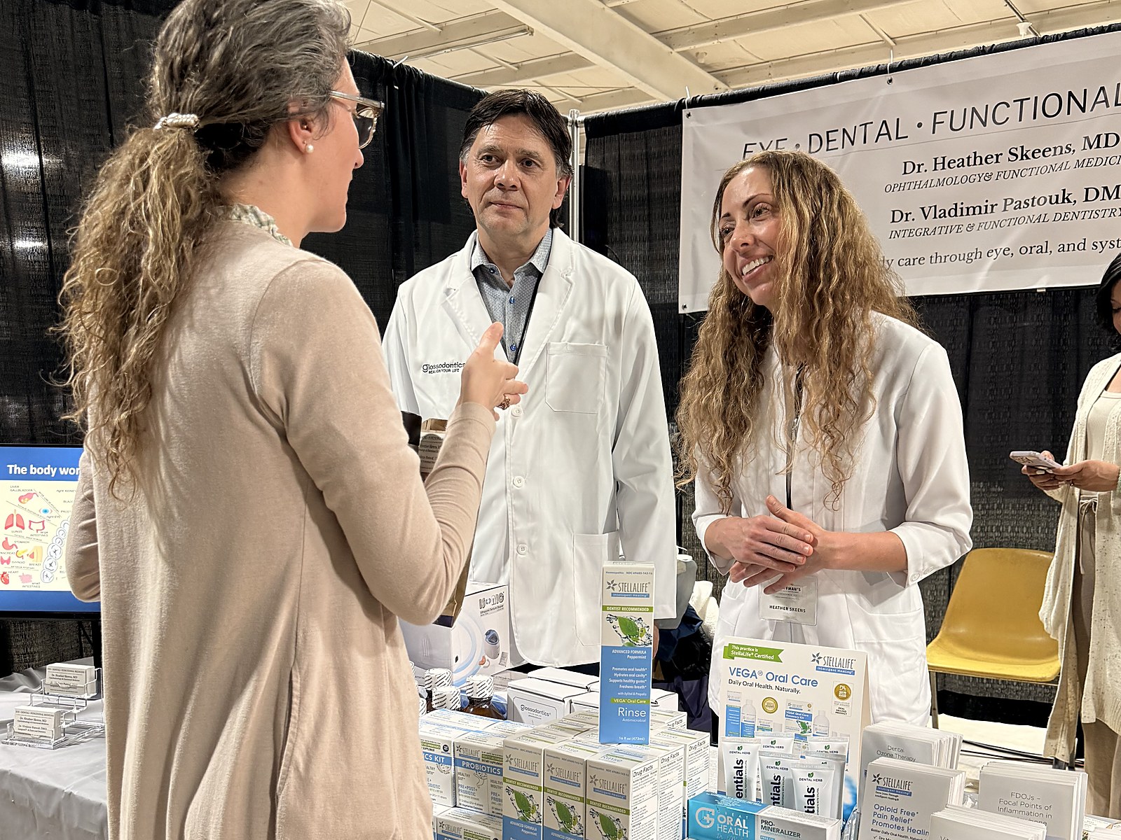 Both Aligness doctors with a patient at a private review